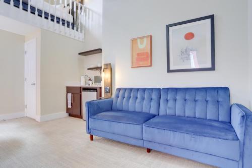 a blue couch sitting in a living room at Sojourn at DuPont Place in Washington