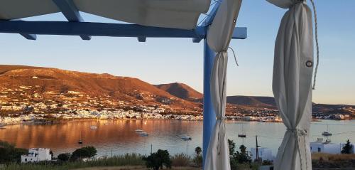 a view of a body of water from a window at Paros Paradise Apartments in Parikia