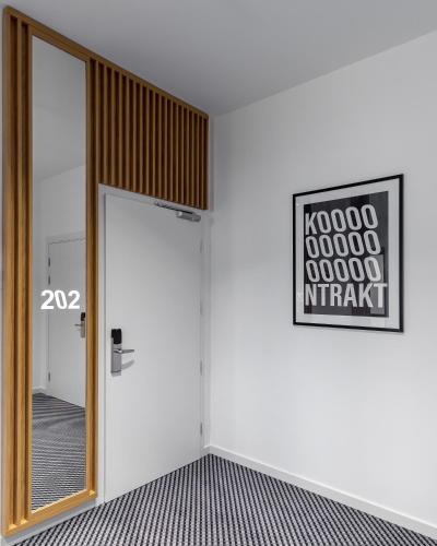 a room with a door and a mirror on the wall at KONTRAKT Boutique Hotel in Kyiv