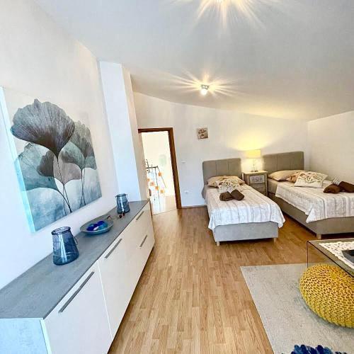 a room with two beds and a room with two beds at Dalmatian village charm - spacious villa with pool near Trogir in Primorski Dolac