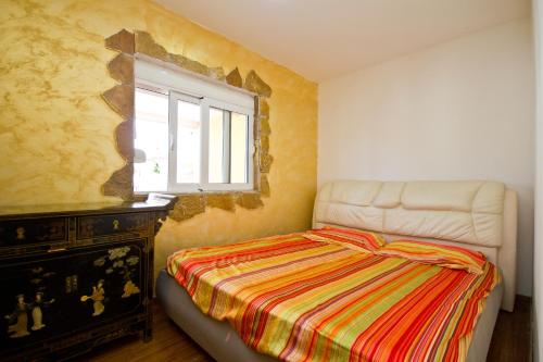 Postel nebo postele na pokoji v ubytování Apartmani Vukčević