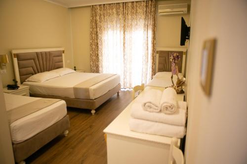 Postel nebo postele na pokoji v ubytování Hotel Vila Mare
