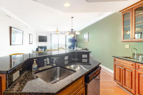 a kitchen with a sink and a counter top at Belmont Towers 410 in Ocean City