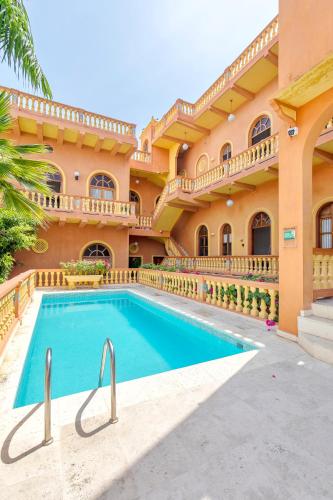 an exterior view of a large house with a swimming pool at Casa Morales Getsemaní in Cartagena de Indias
