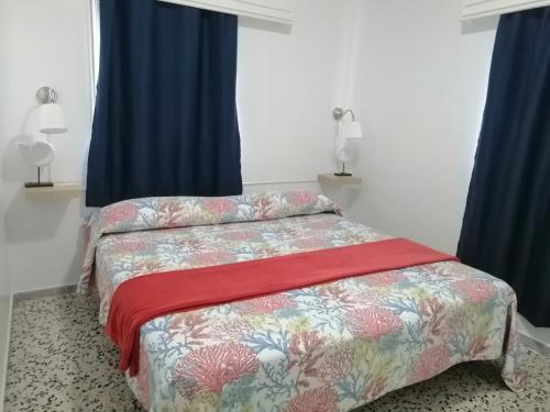 Кровать или кровати в номере Pensión Playa