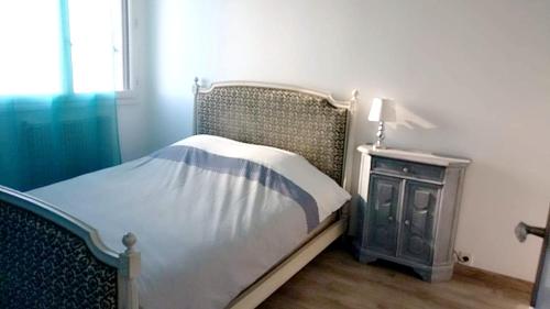 a bedroom with a bed and a dresser and a window at Appartement de 2 chambres avec vue sur la ville et wifi a Clermont Ferrand in Clermont-Ferrand