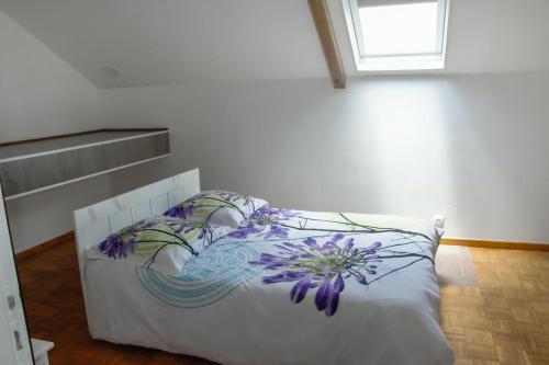 Ένα ή περισσότερα κρεβάτια σε δωμάτιο στο Maison de 5 chambres avec vue sur la mer jardin clos et wifi a Le tampon