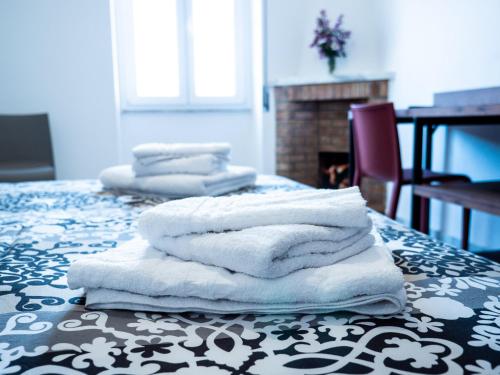 a pile of towels sitting on top of a table at Girastrittue Colobraro in Colobraro