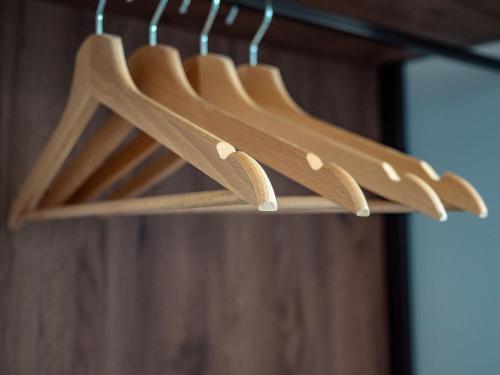 a bunch of wooden hangers on a rack at Girastrittue Colobraro in Colobraro