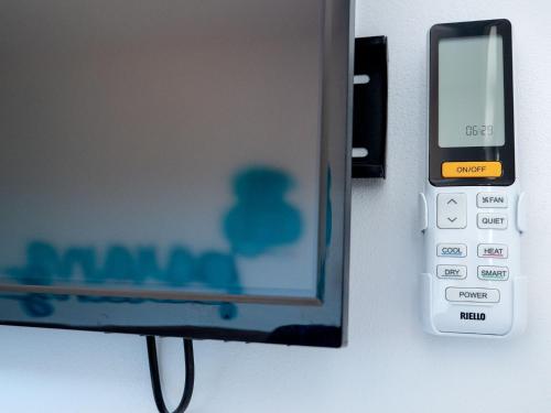 a cell phone is sticking out of a door at Girastrittue Colobraro in Colobraro