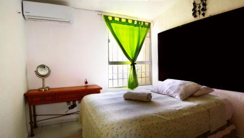 Katil atau katil-katil dalam bilik di Cuarto Privado, Gran Wi-Fi, Jacuzzi Rooftop, AC
