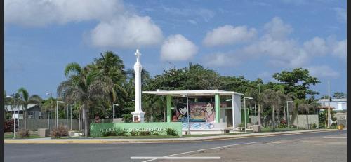 a cross in front of a bus stop with a cross at Casa Peace Haven Beach House Aguada in Aguada