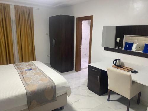 Postel nebo postele na pokoji v ubytování Hôtel Esma Nouadhibou