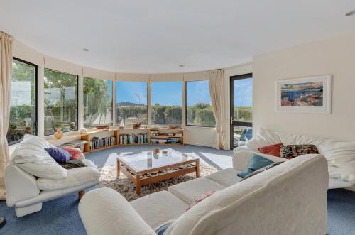 A seating area at Absolute Beachfront Bliss - Waikanae Beach Holiday Home