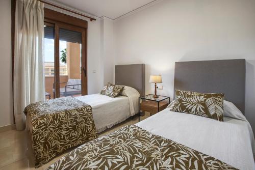 Posteľ alebo postele v izbe v ubytovaní Arenal Cannes
