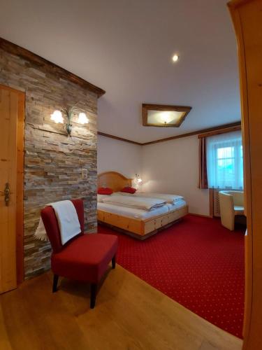 En eller flere senge i et værelse på Landhaus Armstorfer