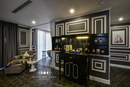 a living room with a couch and a table at Hotel Del Luna Boutique in Da Nang