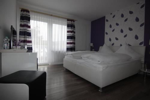 Ein Bett oder Betten in einem Zimmer der Unterkunft Hotel Linden