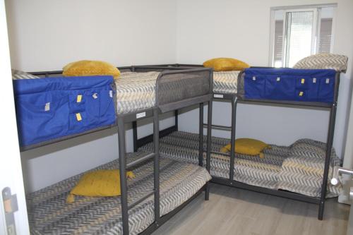 a group of bunk beds in a room at Moradia Bispo in Aljubarrota