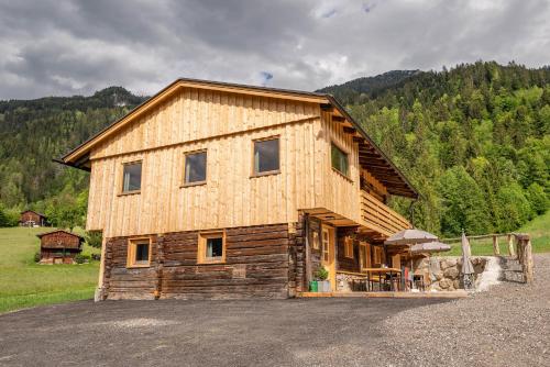 a large wooden house with at STAUDACH - Alpinresidenz Zillertal in Ramsau im Zillertal