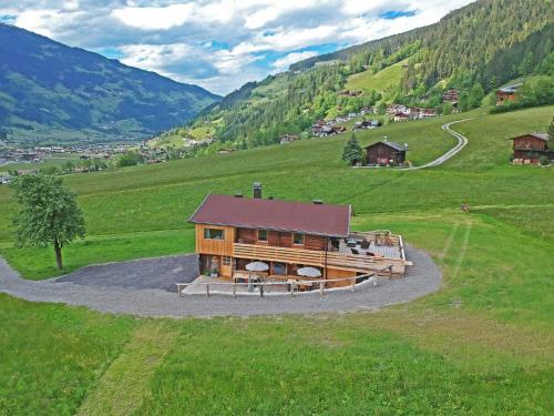 a house in the middle of a green field at STAUDACH - Alpinresidenz Zillertal in Ramsau im Zillertal