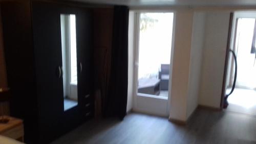 an empty room with two doors and a room with at superbe t2 centre de cognac in Cognac