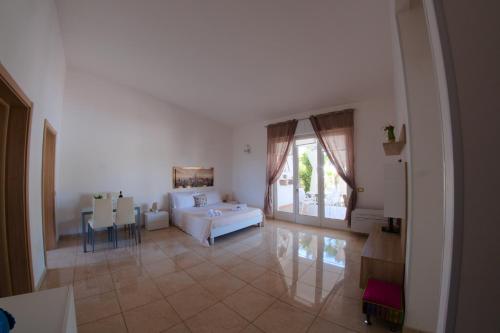 A bed or beds in a room at Li Carlucci