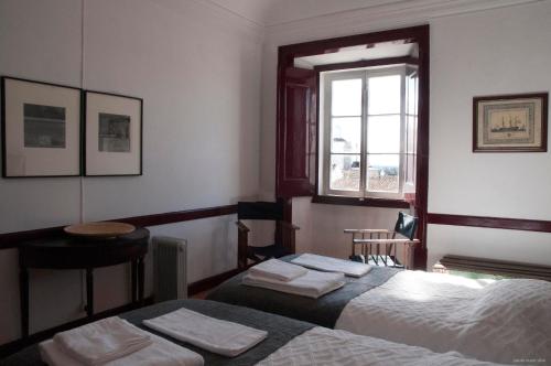Кровать или кровати в номере Casa do Sertório - Casa inteira