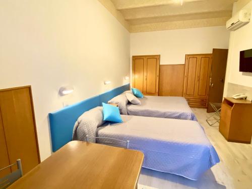 Ένα ή περισσότερα κρεβάτια σε δωμάτιο στο Residence Signa