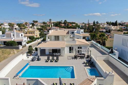 an aerial view of a house with a swimming pool at Villa Sun in Carvoeiro