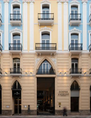 a facade of a building with windows and balconies at Hospes Amérigo, Alicante, a Member of Design Hotels in Alicante
