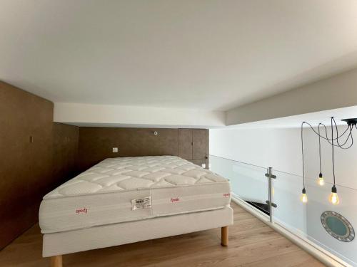 Кровать или кровати в номере Garibaldi 11