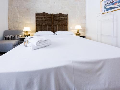 Ένα ή περισσότερα κρεβάτια σε δωμάτιο στο Poggiamico Guest House