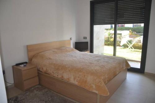 Ліжко або ліжка в номері Appartement Residence Skhirat beach 2