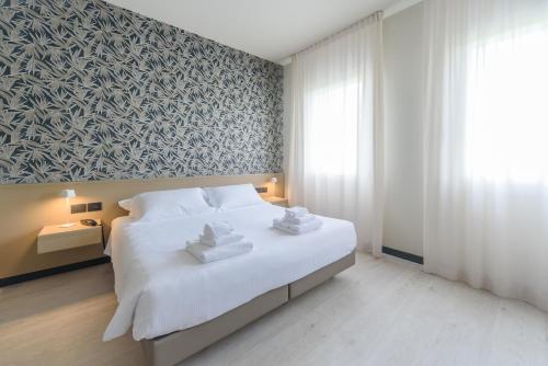 Posteľ alebo postele v izbe v ubytovaní Hotel Zenit