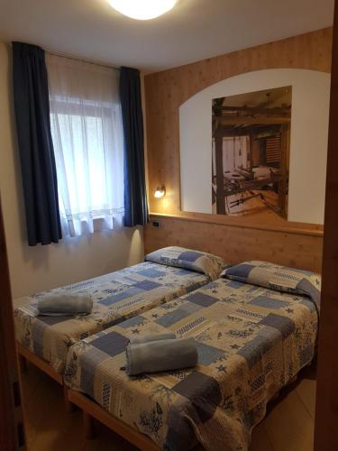 Ένα ή περισσότερα κρεβάτια σε δωμάτιο στο Casa Alice 5.5