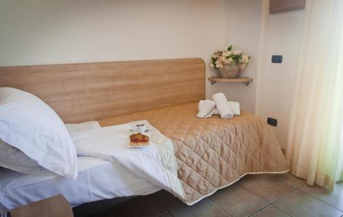 Ένα ή περισσότερα κρεβάτια σε δωμάτιο στο Hotel Costazzurra by Interlux