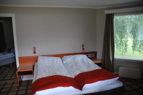 Ένα ή περισσότερα κρεβάτια σε δωμάτιο στο Fleischer's Motel