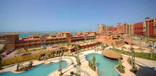 an aerial view of a resort with a swimming pool at sea view apartment in Porto Marina hotel tower in El Alamein