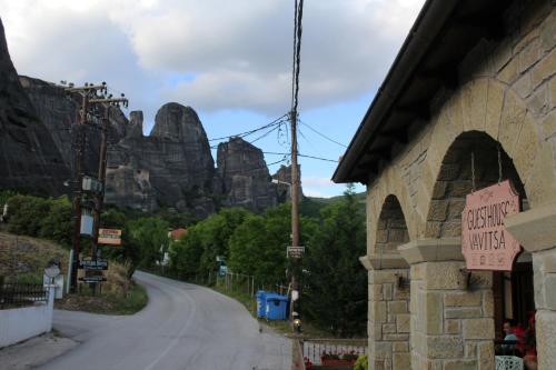 an empty road with a mountain in the background at Guesthouse Vavitsas in Kalabaka