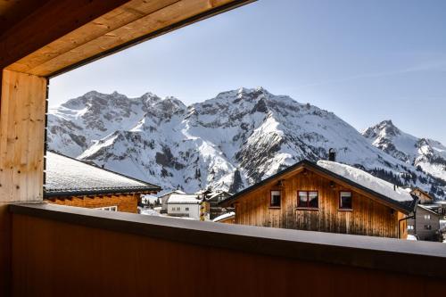 a view from a window of a mountain at Haus Alpenblick in Schröcken