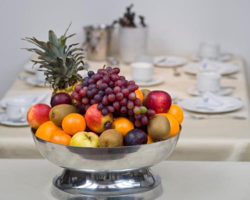 a bowl of fruit sitting on a table at Hotel Domschenke in Billerbeck