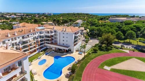 an aerial view of a building with a swimming pool at AP Victoria Sports & Beach in Albufeira
