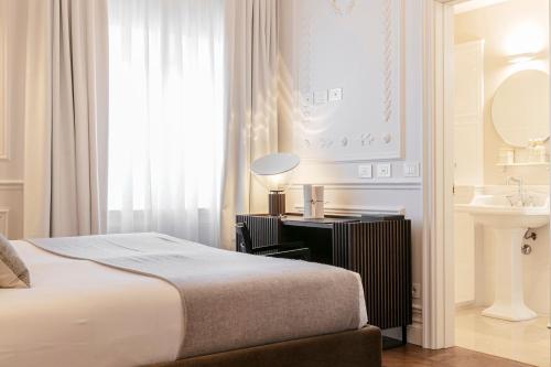 Postel nebo postele na pokoji v ubytování Dimora Palanca Boutique & SPA