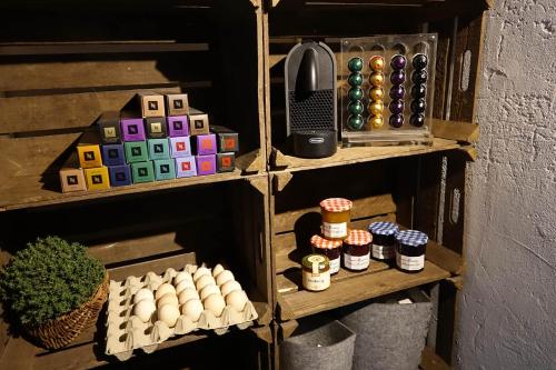 a wooden shelf with eggs and a phone on it at Schittlerhaus in Oberstdorf