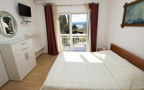 Postel nebo postele na pokoji v ubytování Apartment MERI (4172)