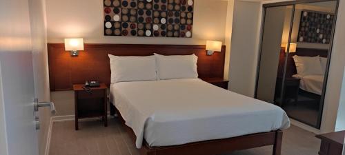 Giường trong phòng chung tại Hotel Sao Mamede