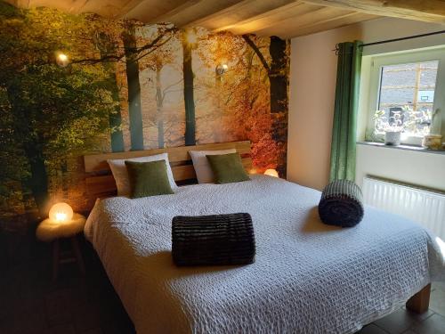 A bed or beds in a room at Le Clos du Cerf - Le Sous-bois