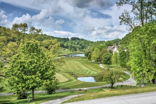 an aerial view of a golf course with a river at Picturesque Sky Haus Sanctuary with Mountain Views in Sky Valley