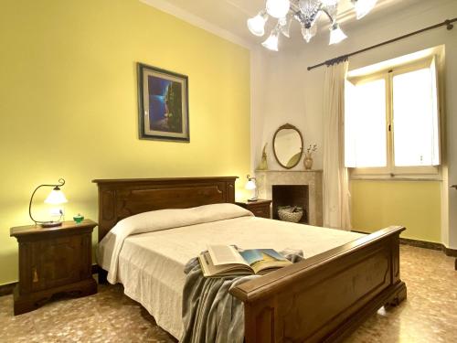 Ένα ή περισσότερα κρεβάτια σε δωμάτιο στο Villa Rocco Rooms